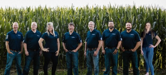 loan officers standing in cornfield