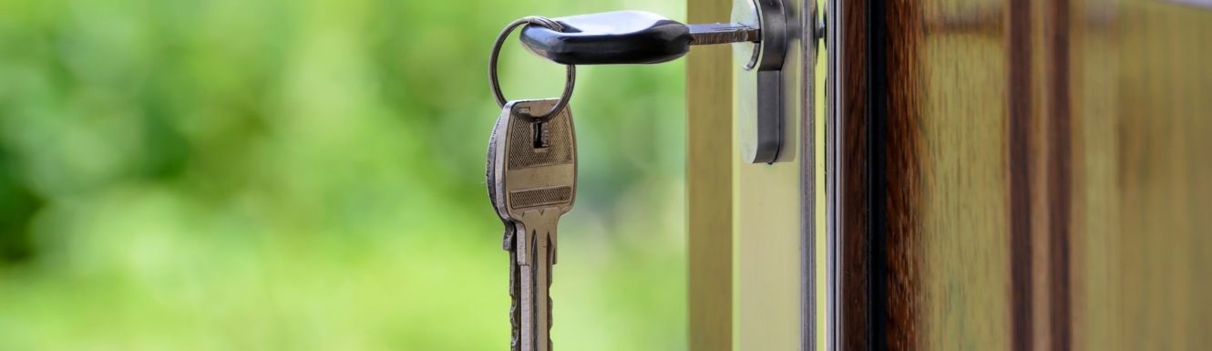 close up image of key in a door