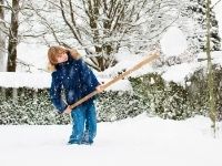 Boy shoveling snow