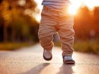 bottom half of a child learning to walk